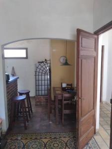 a room with a table and chairs and a door at Piriápolis a 4 cuadras de playa,"Las Hortensias" in Piriápolis