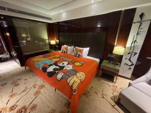Llit o llits en una habitació de Estandon Hotel Guangzhou