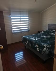 En eller flere senge i et værelse på ICARUMBI