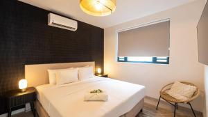 Ένα ή περισσότερα κρεβάτια σε δωμάτιο στο Indigo Suite Curaçao - A Brand New Modern Apartment on a secure resort close to the Beach
