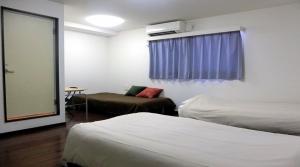 Ένα ή περισσότερα κρεβάτια σε δωμάτιο στο Hotel Chuo Oasis