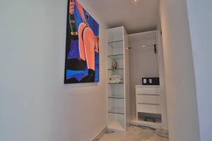 a walk in closet with a painting on the wall at Guest Friendly Cartagena 2BR Jacuzzi stripper pole in Cartagena de Indias