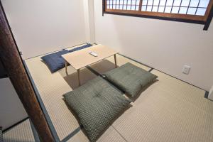 an overhead view of a table and chairs in a room at - UMI-Haven 福島 - 隣駅5LDK戸建 in Osaka