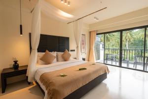 Postel nebo postele na pokoji v ubytování Samaya Wellness Resort