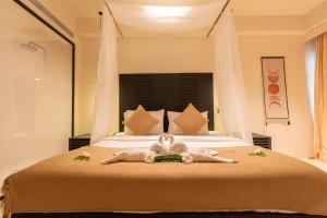 Postel nebo postele na pokoji v ubytování Samaya Wellness Resort