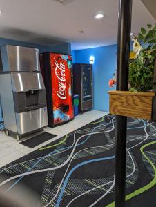 a room with two coke machines and a cocacola machine at Super 8 by Wyndham Staunton in Staunton