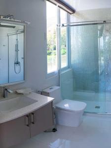 a bathroom with a sink and a toilet and a shower at CASONA LA MARQUEZA - Hotel Boutique in Tinquipaya