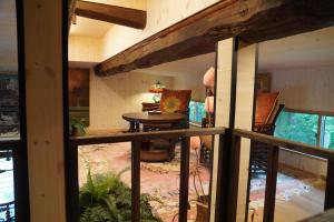 a view of a room with a table and chairs at POND CABIN Myoko - Vacation STAY 15921 in Myoko