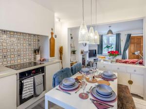 a kitchen with a table with plates on it at 2 Bed in Holbrook 90496 in Belper