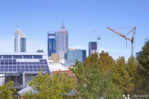 a city skyline with a crane and some buildings at A peaceful room in Northbridge with free parking in Perth