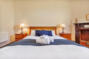 a bedroom with a bed with a towel on it at Barossa Vineyard Guesthouse in Tanunda