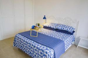 Ένα ή περισσότερα κρεβάτια σε δωμάτιο στο Iodio Studio - Cozy home with pool