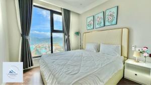 Postel nebo postele na pokoji v ubytování Bluewaves Apartment Quy Nhon - Altara Seaview