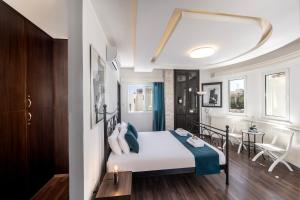 a bedroom with a bed and a table and chairs at Accomoteleia Crystal Lagoon Villa in Protaras +30 photos