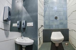 a bathroom with a toilet and a sink at FabExpress Pramila Prakash in Nagpur