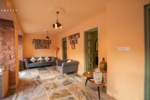 a living room with a couch and a table at Zostel Jodhpur, Ratanada in Jodhpur