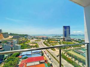 a view of the city from the balcony of a building at GRAD 1989's Homes Halong in Ha Long