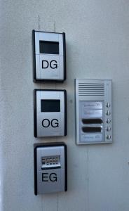 a wall with four microwaves on a wall at B&K Immobilien GbR in Tangermünde