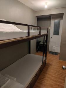 Postel nebo postele na pokoji v ubytování Cebu Pungko-pungko Hostel