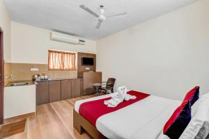a bedroom with a bed with an animal on it at Season 4 Residences -Thiruvanmiyur Near Tidel park Apollo Proton cancer center and IIT Madras Research Park in Chennai