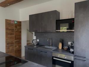 Kuchyň nebo kuchyňský kout v ubytování Arnfels Residences am Tor zur Südsteirischen Weinstraße