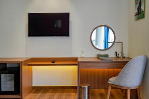 TV a/nebo společenská místnost v ubytování Rung Thong Nui Voi Villa & Resort
