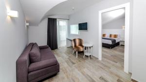 Телевизор и/или развлекательный центр в Motto Premium Hotel&Spa