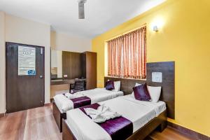 Postel nebo postele na pokoji v ubytování Season 4 Residences -Thiruvanmiyur Near Tidel park Apollo Proton cancer center and IIT Madras Research Park