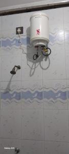a camera on the wall of a room with water at Villa Souhayl homestay in Puducherry