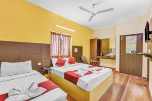 Postel nebo postele na pokoji v ubytování Season 4 Residences -Thiruvanmiyur Near Tidel park Apollo Proton cancer center and IIT Madras Research Park