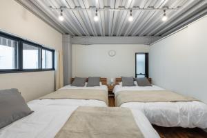 Voodi või voodid majutusasutuse 船堀戸建 toas