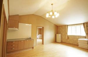 a room with a kitchen with a ceiling at Jeju Arbon Resort in Jeju