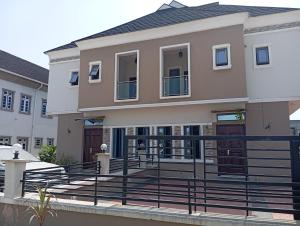 a house with a balcony in front of it at Frontline Homes & Suites 3bedroom Apartment in Lekki