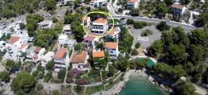 an aerial view of a house with a yellow circle at Silvija Apartments in Primošten