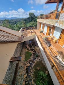 an external view of a house with a garden at MăngDiang Boutique Hotel in Kon Von Kla