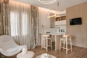 TV a/nebo společenská místnost v ubytování PIAZZA SUITES