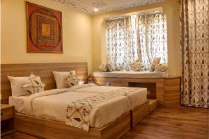 מיטה או מיטות בחדר ב-Ranthambhore Uday Vilas