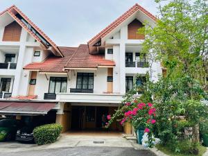 a house with a red roof at FamilyHaven at Presint 18 by Elitestay [5Rooms] in Putrajaya
