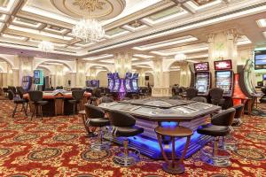 a casino with a bunch of slot machines at Salamis Bay Conti Hotel Resort & SPA & Casino in Mağusa