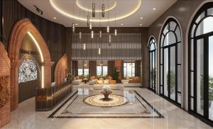a lobby with a fountain in the middle of a building at Hoang Yen Boutique Hotel in Dien Ban