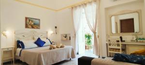 Postel nebo postele na pokoji v ubytování B&B Venus Inn Positano