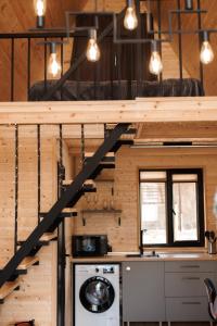 a staircase in a tiny house at SMART Via Kazbegi in Stepantsminda