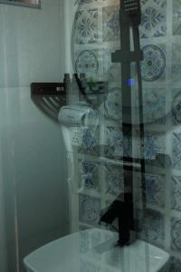 a glass window of a bathroom with a sink at SMART Via Kazbegi in Stepantsminda