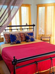 A bed or beds in a room at The Place by the Sun