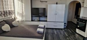 a living room with a couch and a white cabinet at Black and White Apartment in Karlovo