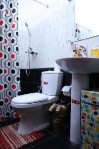 a bathroom with a toilet and a sink at Vero Homestay Galle- Your Home Away From Home! in Galle