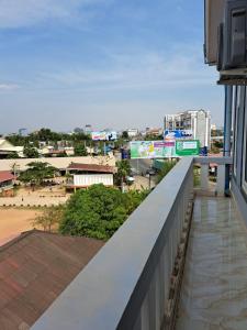 a view of a city from the balcony of a building at Guesthouse Chamroeun Mongkul in Kampot