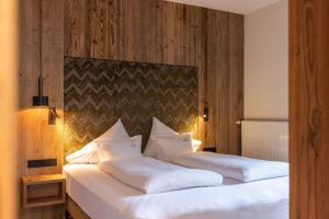 Letto o letti in una camera di Hotel Sonnenspitze