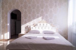 Ένα ή περισσότερα κρεβάτια σε δωμάτιο στο Гостиница, Ак-Буура