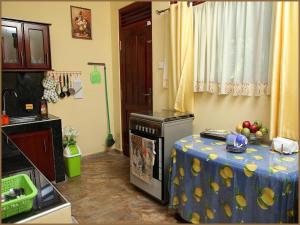 a kitchen with a table with fruit on it at Vero Homestay Galle- Your Home Away From Home! in Galle